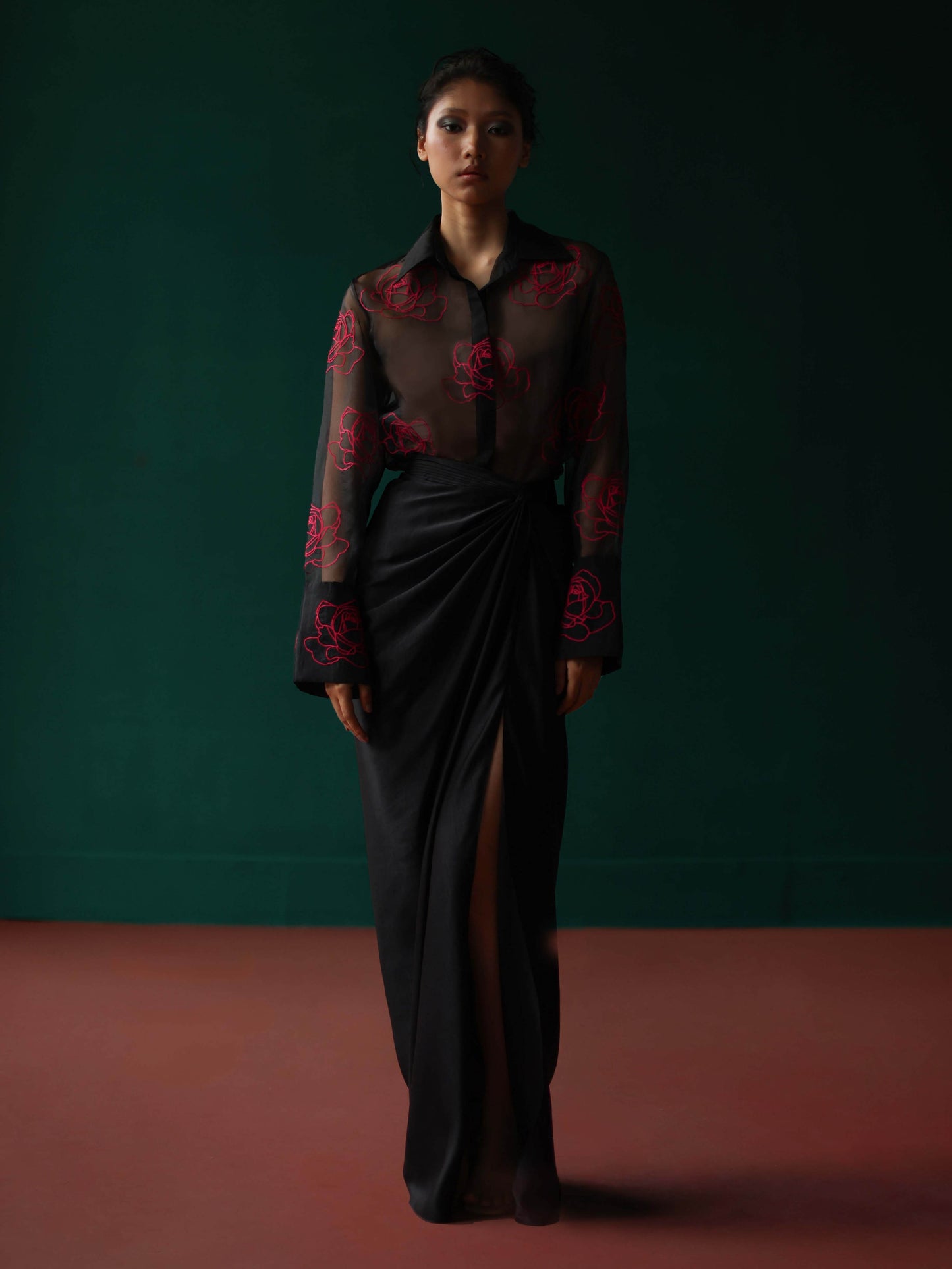 Sheer shirt with dimensional roses paired with twist skirt