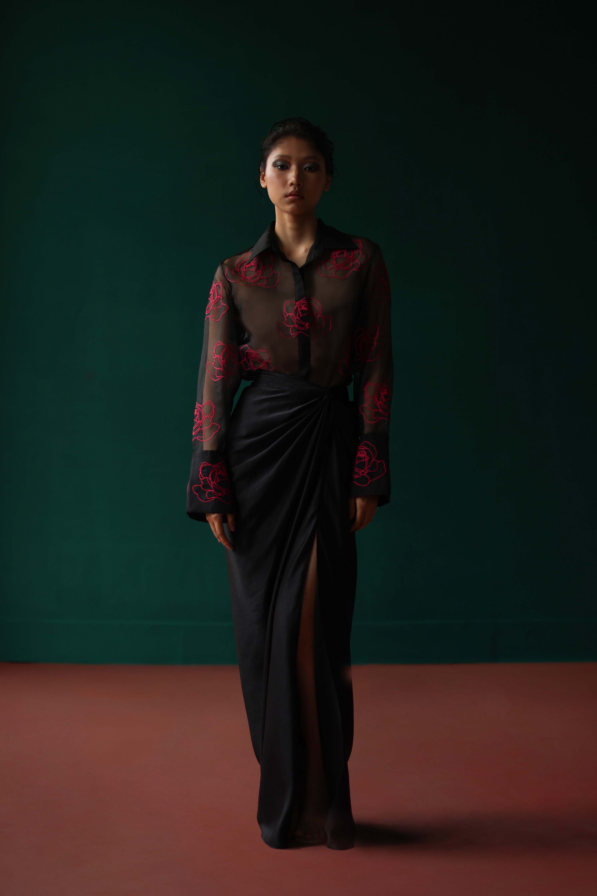 Sheer shirt with dimensional roses paired with twist skirt