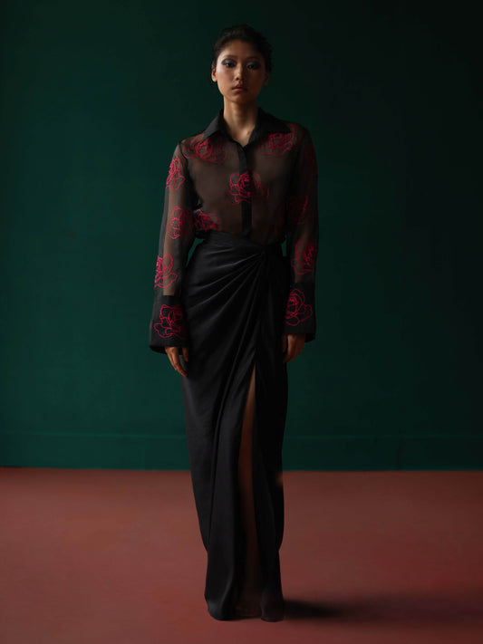 Sheer shirt with dimensional roses paired with twist skirt