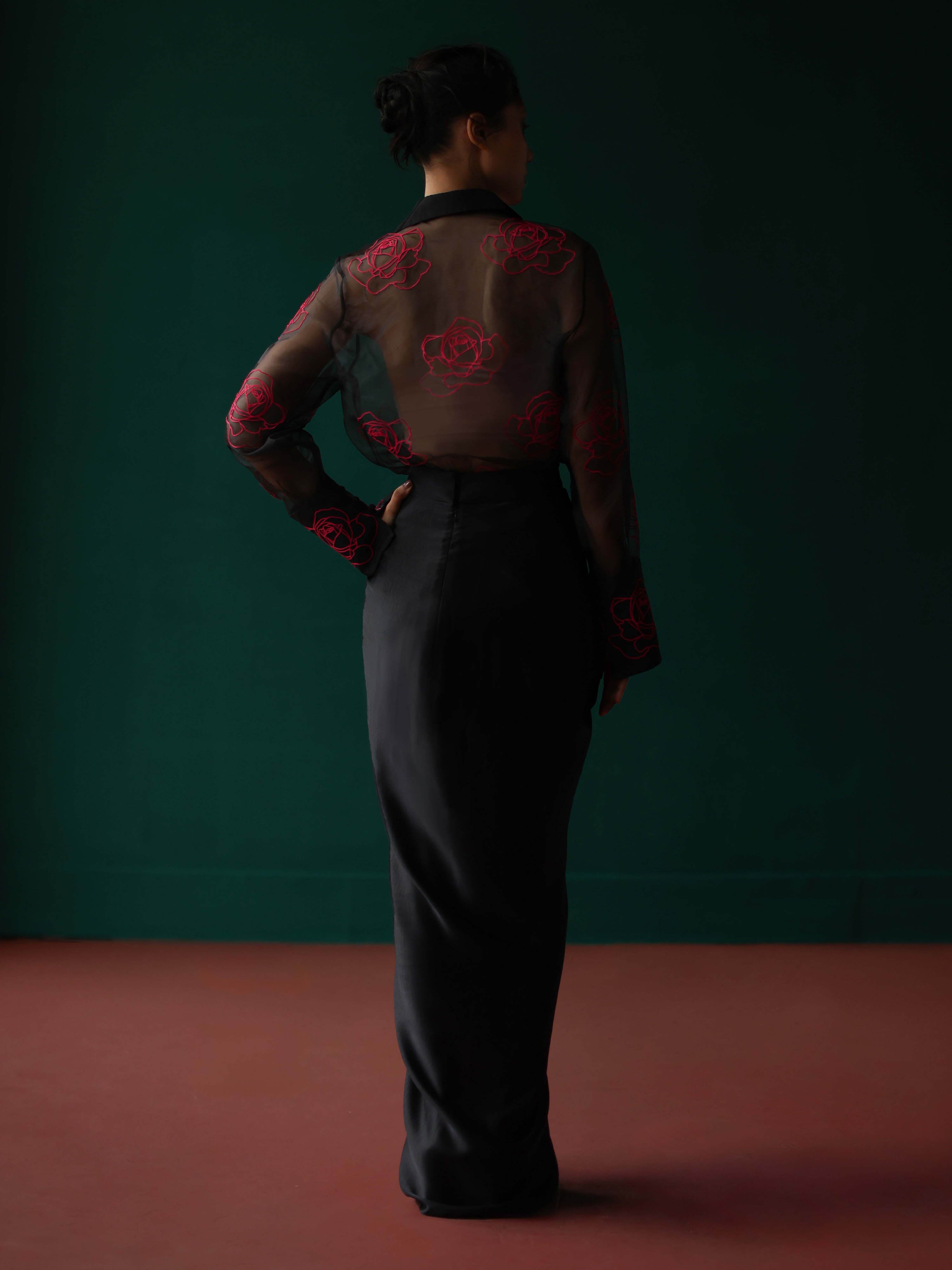 Sheer shirt with dimensional roses paired with twist skirt